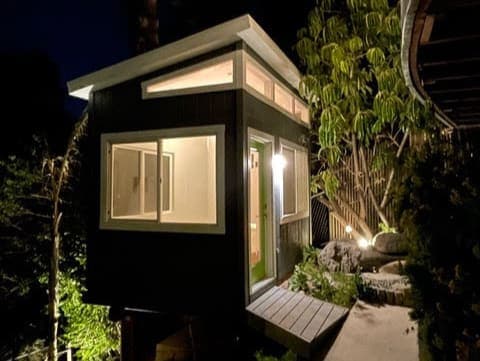 Shed at night with the lights on