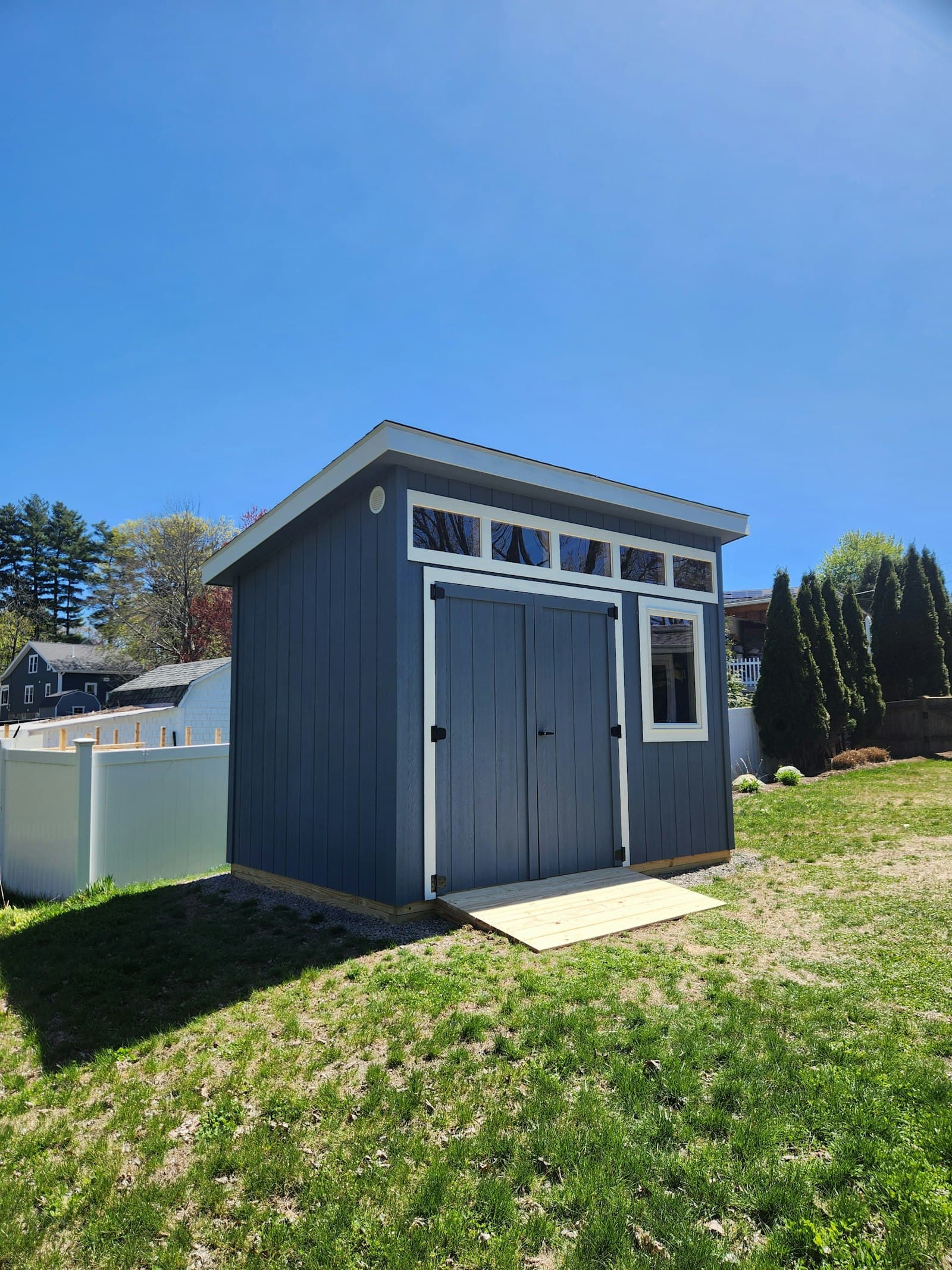 A real 8x12 Tall Modern with t1-11 siding, built onsite in Framingham, MA